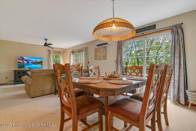 86 Paupack Point Rd, Hawley, PA 18428 - dining area with a wall unit AC, light colored carpet, and ceiling fan