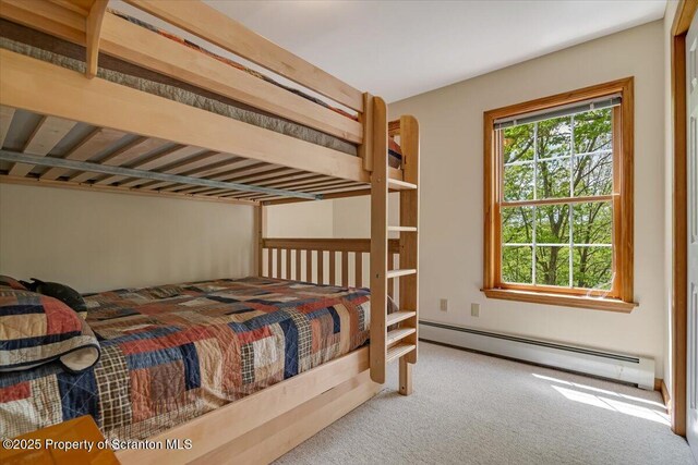 86 Paupack Point Rd, Hawley, PA 18428 - carpeted bedroom featuring a baseboard radiator