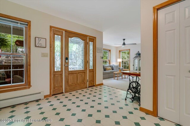 86 Paupack Point Rd, Hawley, PA 18428 - entryway with baseboard heating, light flooring, baseboards, and ceiling fan