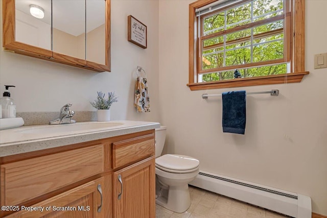 86 Paupack Point Rd, Hawley, PA 18428 - bathroom featuring a baseboard radiator, vanity, toilet, and tile patterned floors