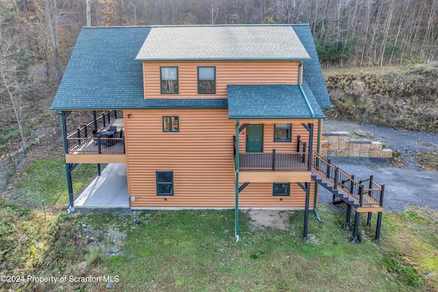 back of property with a patio area