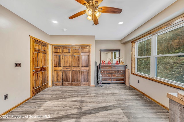 bedroom featuring ceiling fan and wood-type flooring