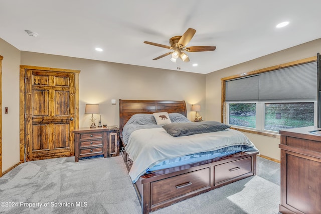 carpeted bedroom featuring ceiling fan