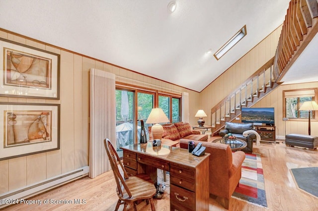 living room with wooden walls, vaulted ceiling, a textured ceiling, baseboard heating, and light hardwood / wood-style floors