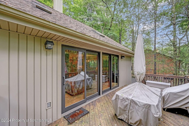 wooden terrace with area for grilling