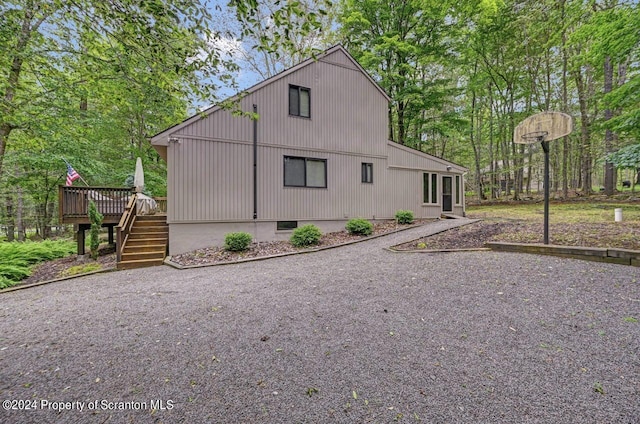 view of property exterior featuring a deck