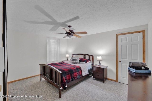 bedroom with a ceiling fan, carpet, a textured ceiling, and baseboards