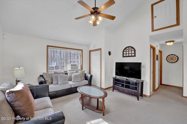 living room with light carpet, high vaulted ceiling, a ceiling fan, and baseboards