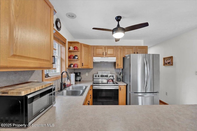 kitchen with open shelves, light countertops, appliances with stainless steel finishes, a sink, and under cabinet range hood