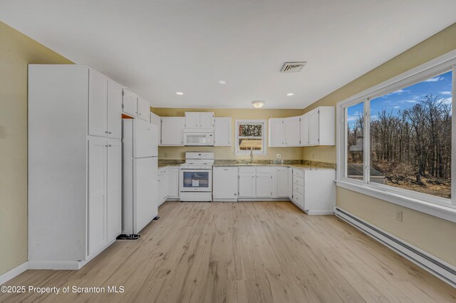 kitchen with visible vents, light wood-style flooring, white cabinetry, white appliances, and baseboard heating