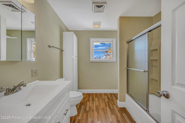 full bath featuring visible vents, toilet, baseboards, and wood finished floors