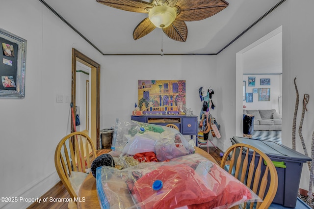 bedroom with ceiling fan and hardwood / wood-style flooring