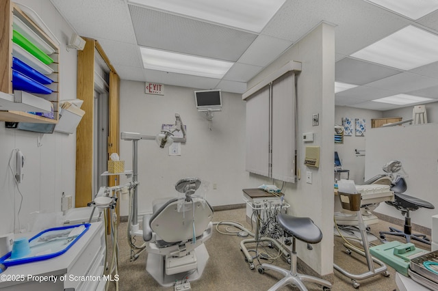 workout area with a drop ceiling and carpet flooring