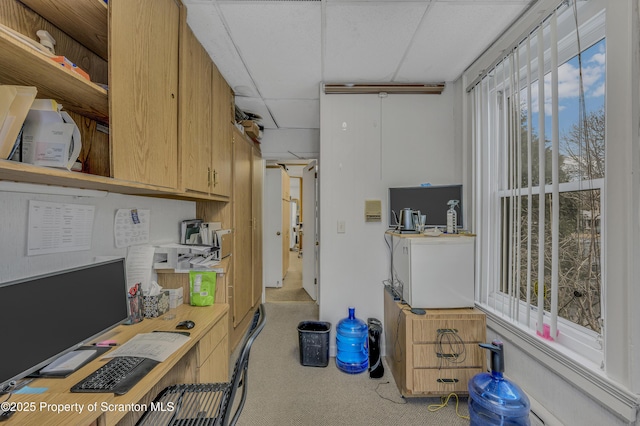 kitchen featuring a paneled ceiling