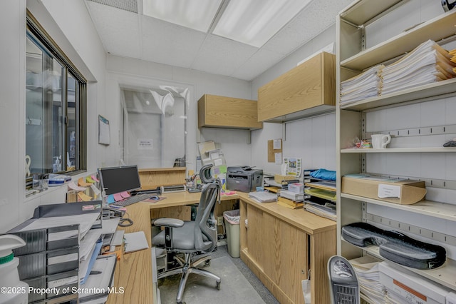 office area featuring a paneled ceiling