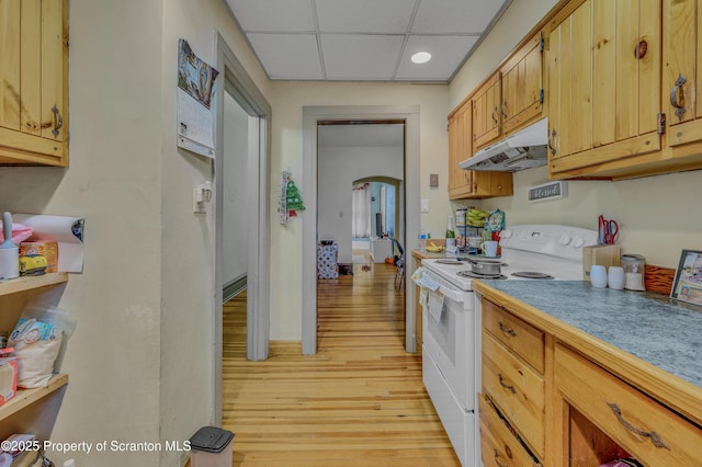 kitchen featuring electric range, a paneled ceiling, and light wood-type flooring