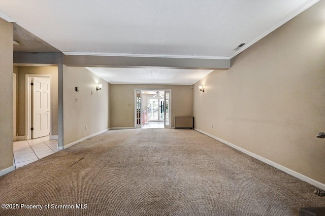 carpeted spare room with ornamental molding and ceiling fan