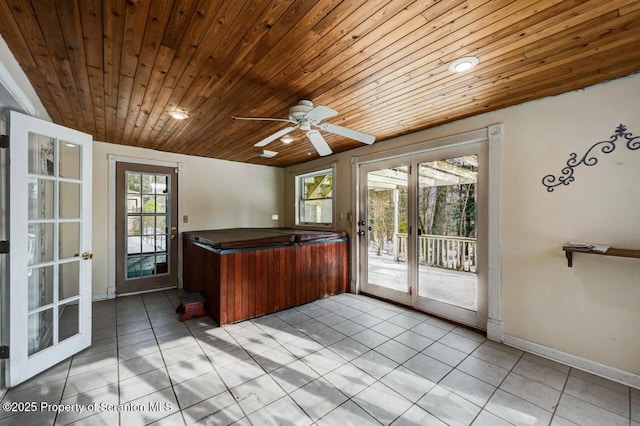 kitchen featuring french doors, light tile patterned flooring, ceiling fan, and wooden ceiling