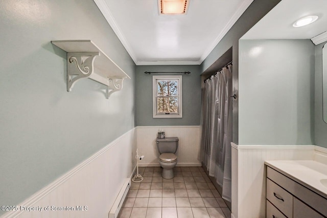 bathroom with ornamental molding, toilet, tile patterned floors, vanity, and baseboard heating