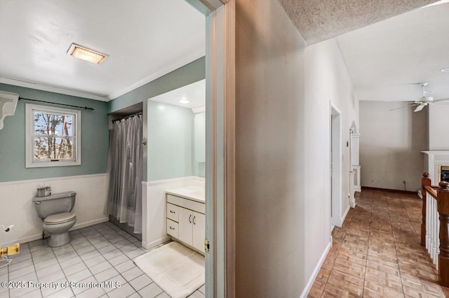 bathroom featuring ceiling fan, vanity, and toilet