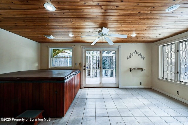 kitchen featuring french doors, light tile patterned flooring, ceiling fan, and wooden ceiling