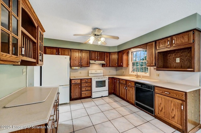 kitchen featuring white appliances, a textured ceiling, ceiling fan, light tile patterned flooring, and sink