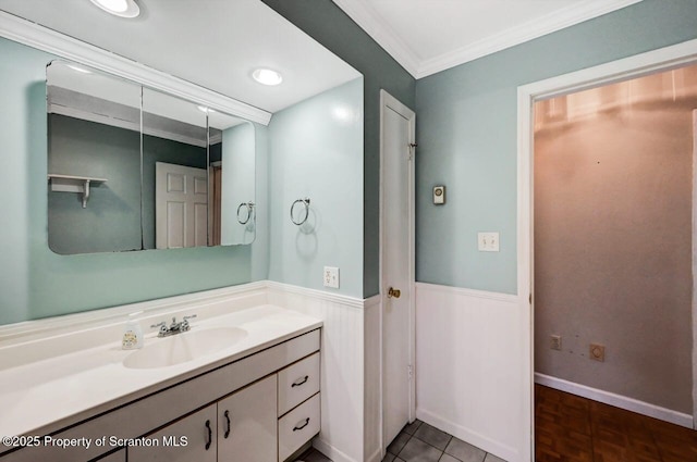 bathroom with ornamental molding and vanity