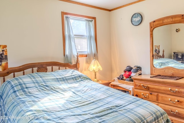 bedroom featuring crown molding