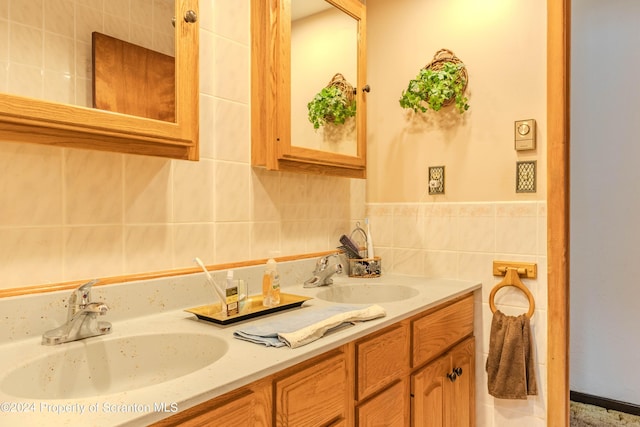 bathroom with vanity and tile walls