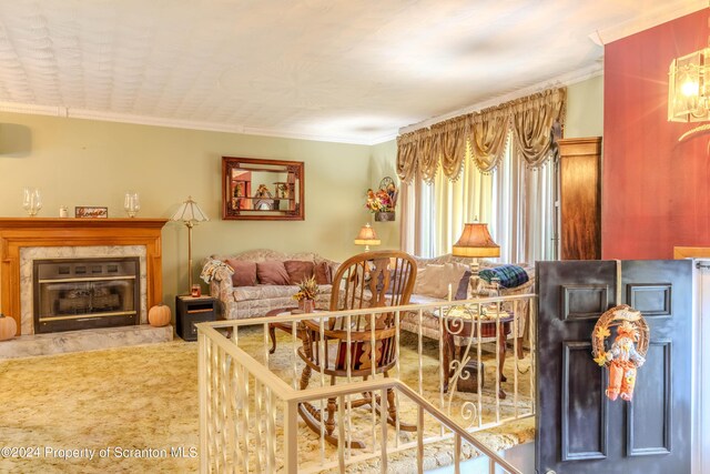 living room with a fireplace, carpet floors, and ornamental molding