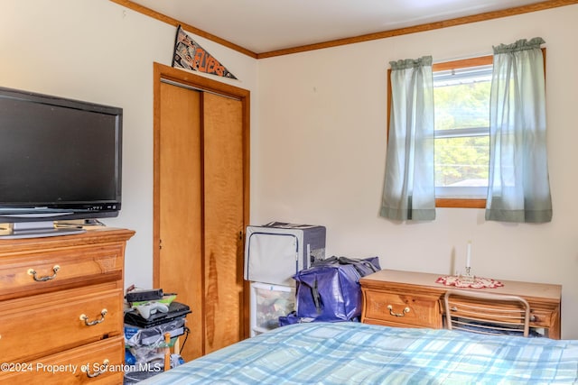 bedroom with crown molding