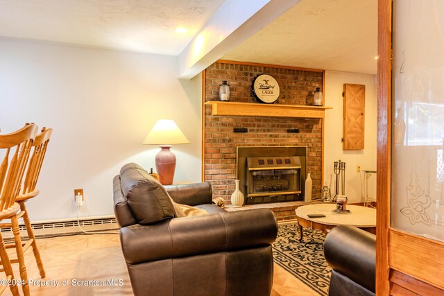 living room with a textured ceiling, a fireplace, and a baseboard radiator