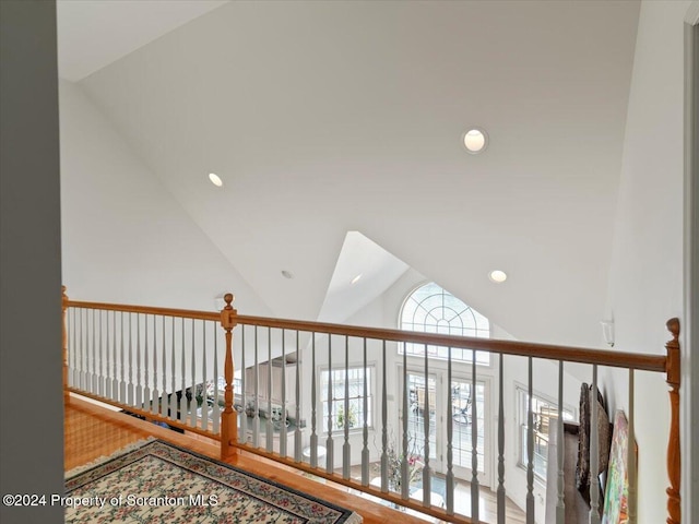 hallway featuring vaulted ceiling