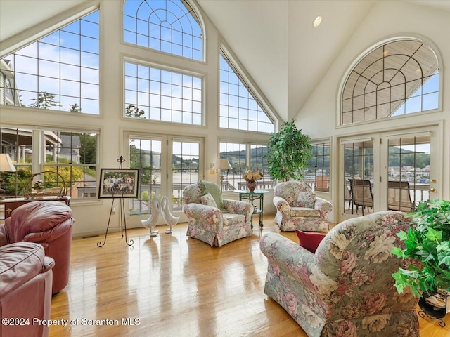 sunroom / solarium featuring french doors