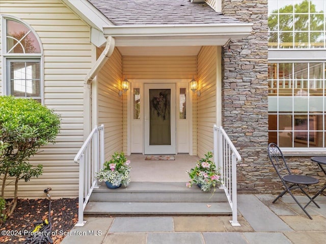 doorway to property featuring a porch