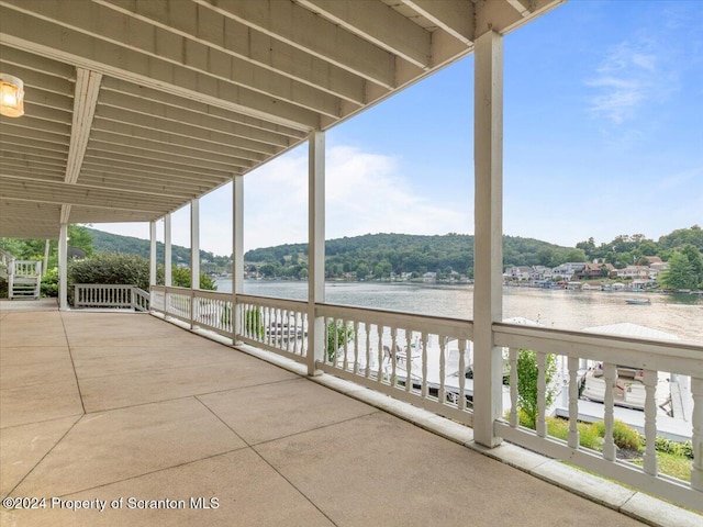 view of patio / terrace featuring a water view