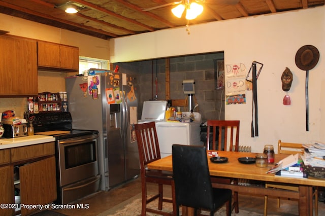 dining space with concrete flooring, washer / clothes dryer, and ceiling fan