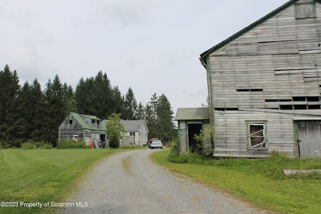 view of home's exterior with a yard