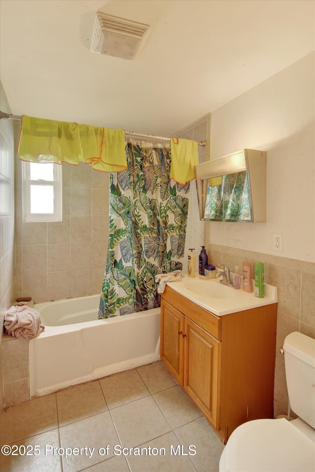 228 Pittston Ave, Scranton, PA 18505 - full bathroom with toilet, vanity, tile patterned flooring, shower / bath combo, and tile walls