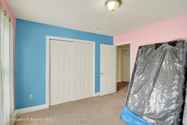 228 Pittston Ave, Scranton, PA 18505 - bedroom featuring carpet, a closet, and baseboards