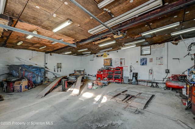 garage with a workshop area