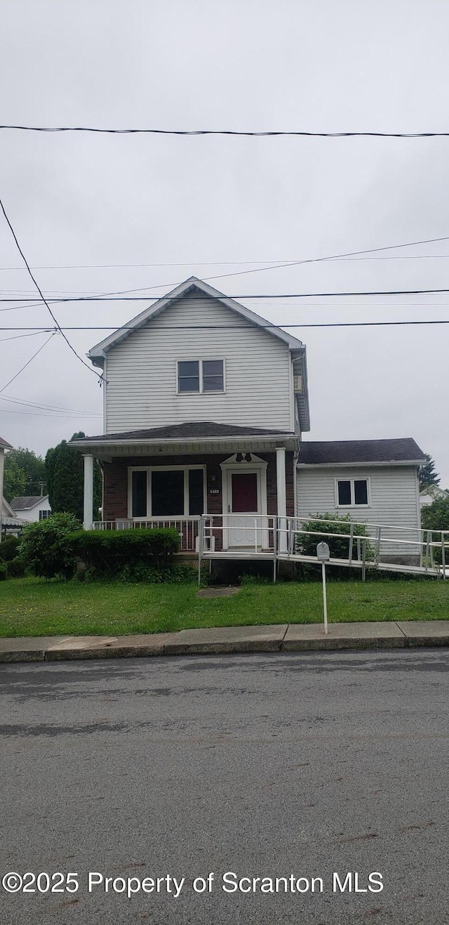 911 Prince St, Taylor, PA 18517 - view of front of property with a fenced front yard and a porch