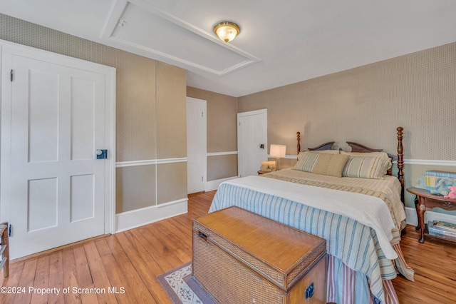 bedroom with wood-type flooring