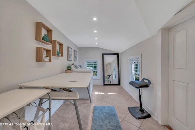 interior space featuring light tile patterned floors and vaulted ceiling