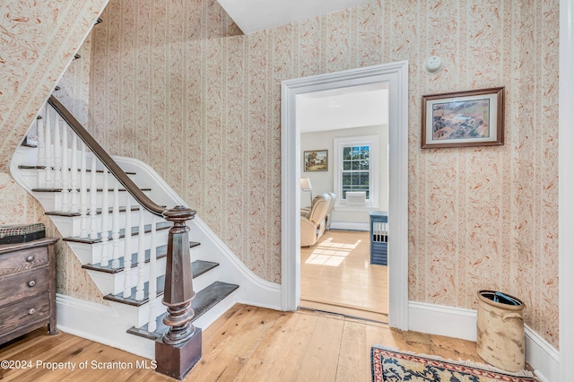 stairway featuring hardwood / wood-style floors