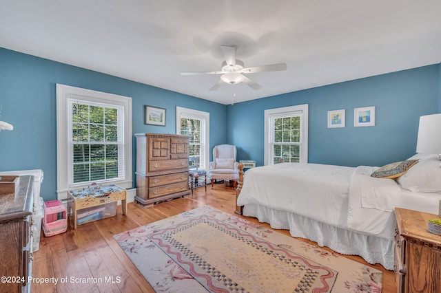 bedroom featuring ceiling fan and hardwood / wood-style flooring