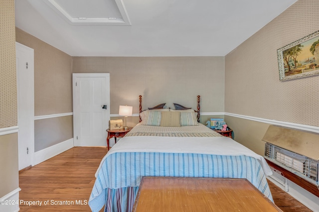 bedroom featuring hardwood / wood-style flooring