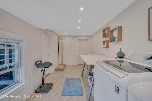 washroom with washer and dryer and light tile patterned floors