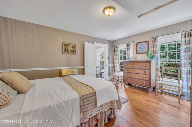 bedroom with hardwood / wood-style flooring