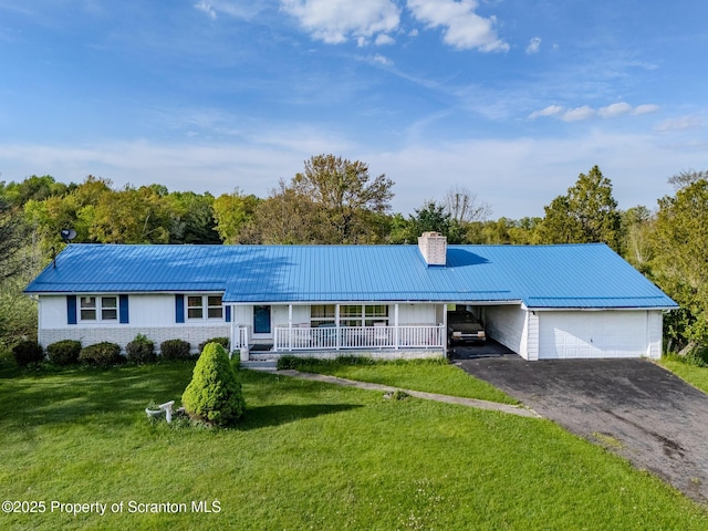 505 Yedinak Ln, Madison Twp, PA 18444 - single story home featuring a chimney, a front yard, metal roof, driveway, and a porch